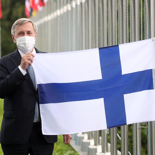 Ambassador Eero Suominen hoists the flag of Finland at the International Vaccine Institute after the country becomes the international organization’s 36th member state following an Accession Ceremony.