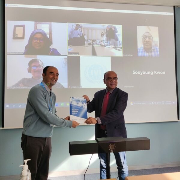 Dr. Nimesh Poudyal, Research Scientist at IVI and Project Lead of CAPTURA, hands over the country report to the Ministry of Health of Bangladesh during a